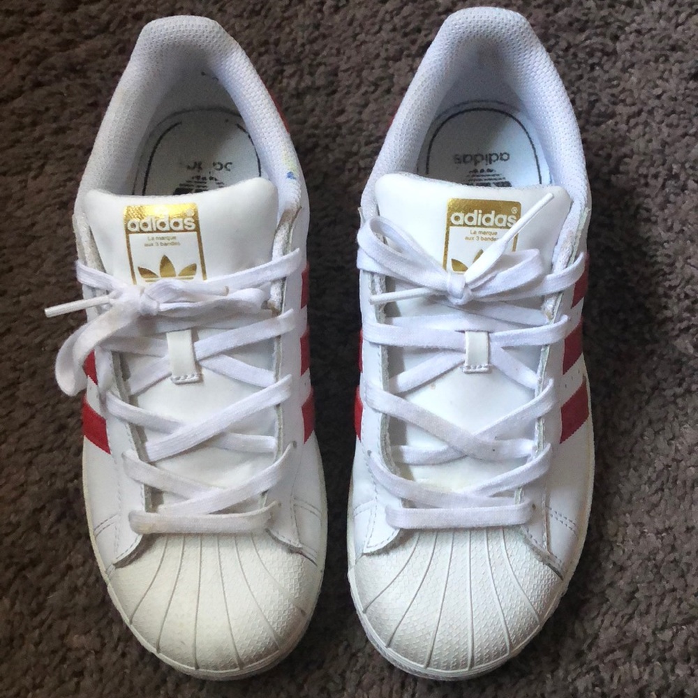 White, red and gold Adidas shelltoes